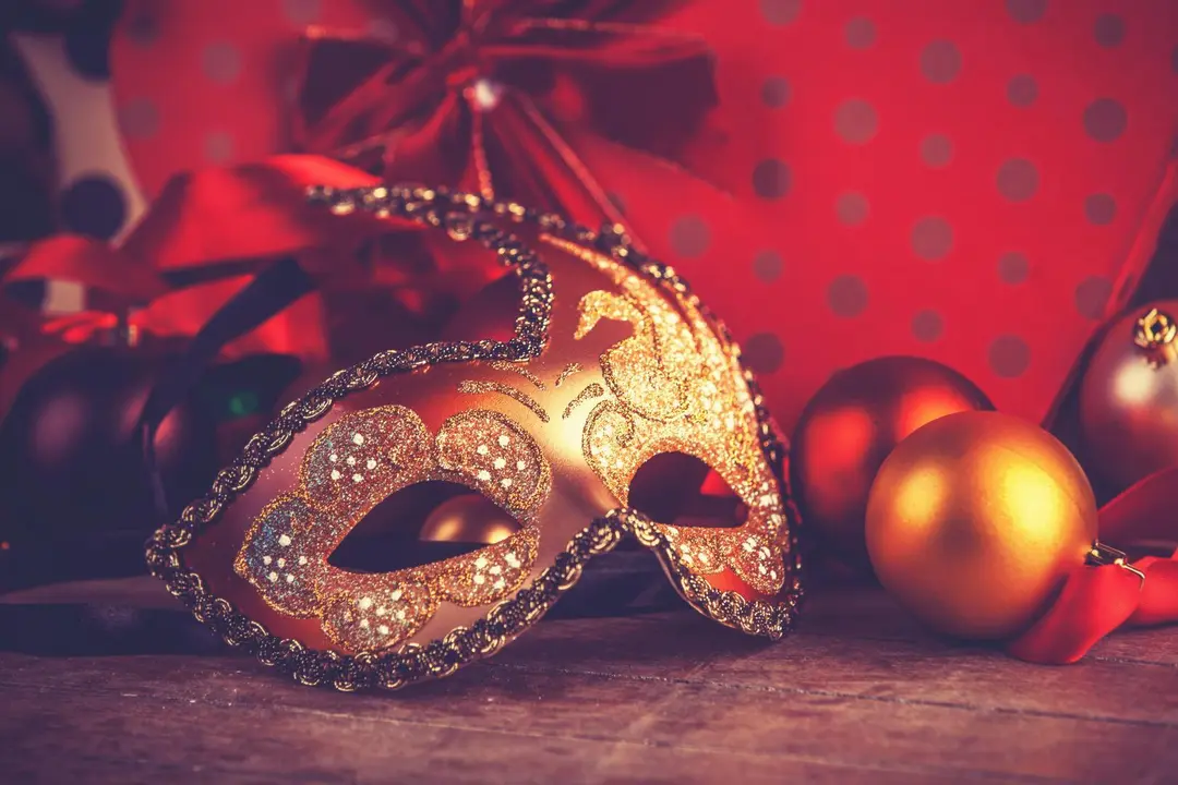 Mask for carnival near gifts. Photo in old color image style
