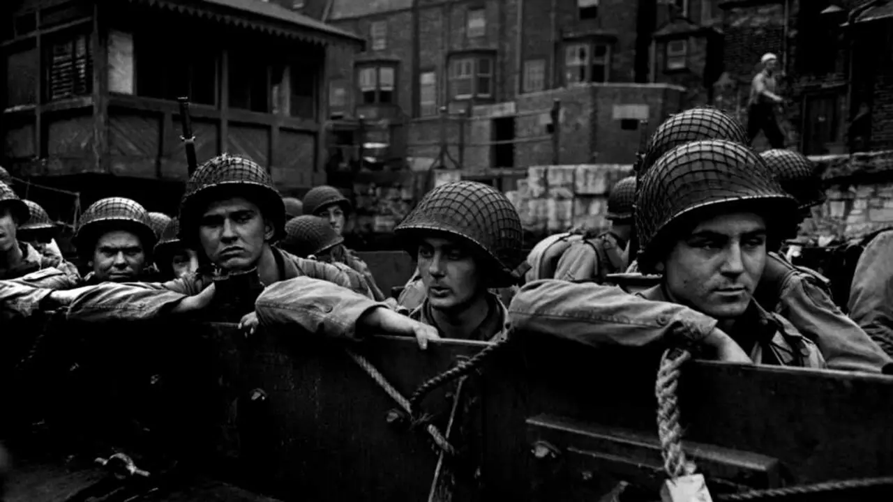 ENGLAND. W.W.II. Planning Operation Overlord.&nbsp;ENGLAND. Dorset. Weymouth. June 5, 1944. American troops in landing craft at Weymouth on their way to liberate France. Angleterre. Dorset. Weymouth. 5 juin 1944. Les troupes am&eacute;ricaines des Forces Alli&eacute;es quittent le port anglais de Weymouth. 
In June 1944 the Allied forces opened a second front in Normandy (after the one in North Africa and Italy) to liberate France. On June 6th, in what was later called D-Day, 90,000 soldiers landed on Omaha Beach (the coded name for Coleville-sur-Mer). Many of them were killed by German troops, but the Allies managed nonetheless to defeat the Germans. &copy; Robert Capa/Centro Internacional de Fotograf&iacute;a/Magnum Photos.